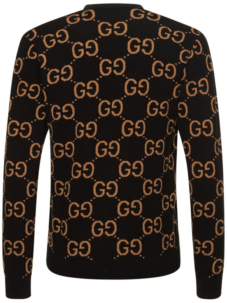 Gucci Cosmogonie. Front button closure. Ribbed collar, cuffs and hem. All over pattern placement may vary. Model is wearing a sizeM Classic Gucci Sweater With Ribbed Cuffs, Gucci Jacquard Knit Long Sleeve Cardigan, Gucci Designer Jacquard Knit Cardigan, Designer Gucci Jacquard Knit Cardigan, Designer Black Jacquard Knit Sweater, Gucci Jacquard Knit Cardigan For Fall, Gucci Long Sleeve Jacquard Knit Cardigan, Casual Gucci Sweater For Work, Gucci Fall Sweater With Ribbed Cuffs