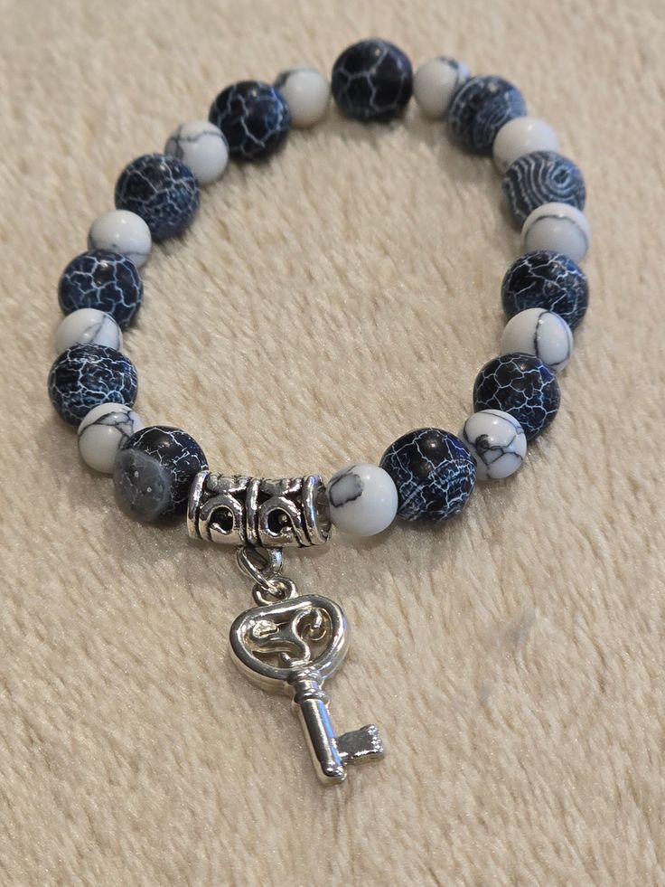 Black, grey and white beaded bracelet with charm. White Beaded Bracelet, Beautiful Beaded Bracelet, Jacksonville Fl, Black Grey, Beaded Bracelet, Grey And White, Diy Jewelry, Charm Bracelet, Beaded Bracelets