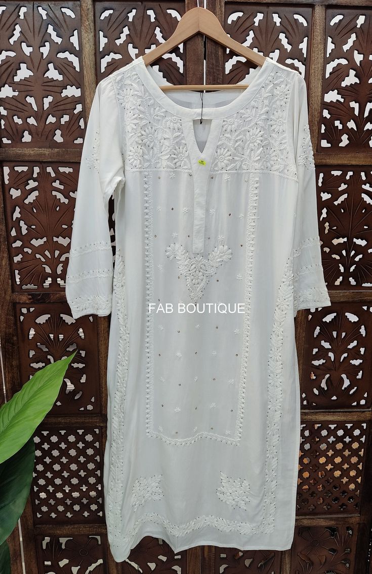 Description ▪ Fabric: Muslin ▪ Sleeves: 3/4 Sleeves ▪ Style: Straight Kurti ▪ Kurti Length: 44-46 Inches ▪ Occasions: Party Wear, Office Wear, Festive Wear ▪ Garment Care: Hand Wash Only ▪ Package Contains: 1x Kurti Disclaimer : Color may be little vary due to lighting effect. Traditional Eid Kurta With 3/4 Sleeves, Eid Long Sleeve Kurta With Handwork, Traditional 3/4 Sleeve Kurta For Eid, Traditional Kurta With 3/4 Sleeve For Eid, Traditional 3/4 Sleeve Kurta For Diwali, Traditional Embroidered Kurta With 3/4 Sleeves, Traditional Embroidered 3/4 Sleeve Kurta, White Handwork Traditional Wear For Festivals, White Traditional Wear With Handwork For Festivals