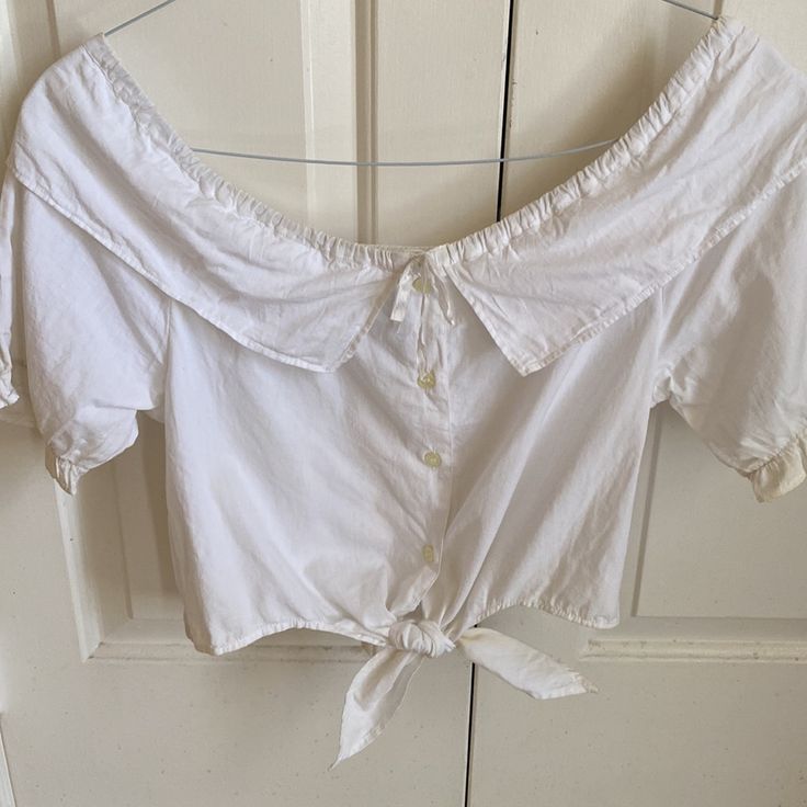 This Is A Nwt, All White Cotton Button Down Crop Top With Wide Collar And Tails To Tie Up. Casual White Blouse With Cute Collar, White Casual Blouse With Cute Collar, Cute Button-up Summer Tops, Cute Summer Button-up Tops, White Button Closure Tops For Spring, White Tops With Button Closure For Spring, White Button-up Tops With Buttons, White Cotton Top With Button Closure, White Cotton Tops With Button Closure