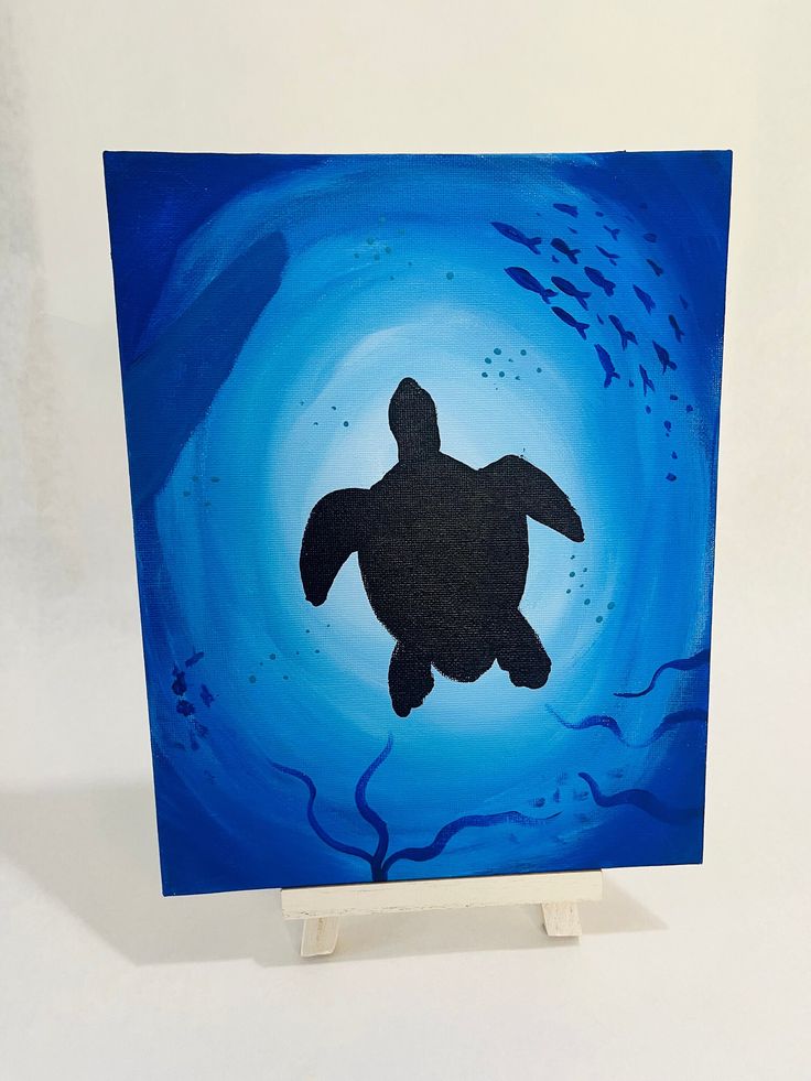 a painting of a turtle swimming in the ocean