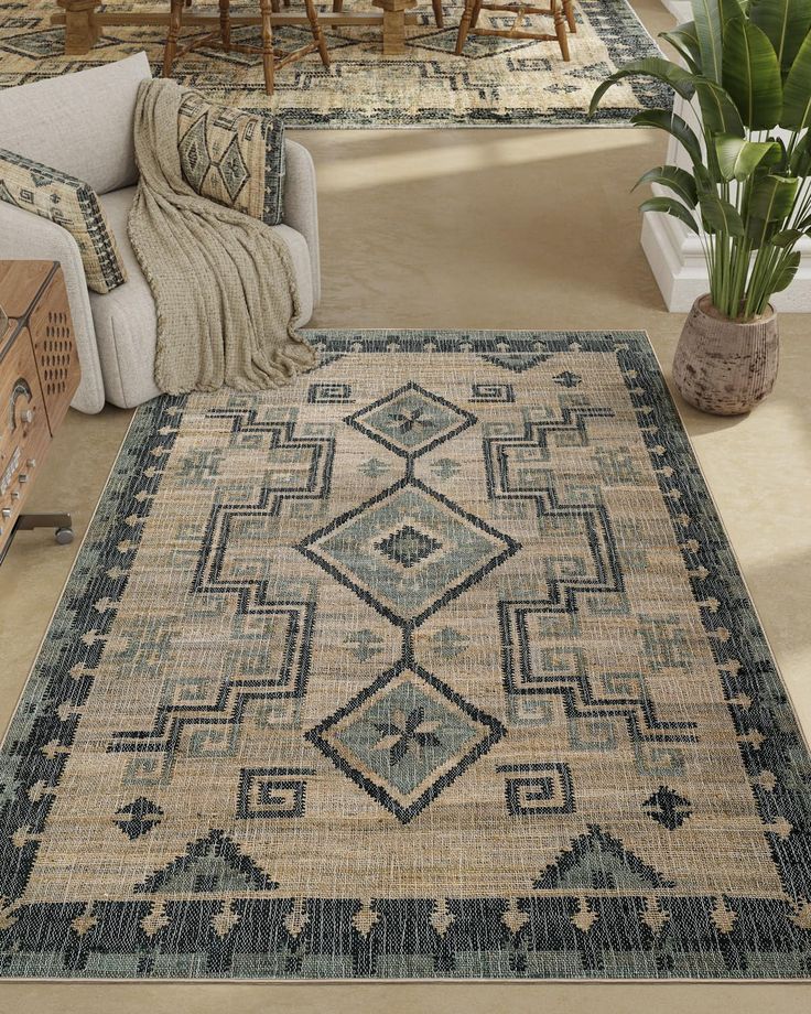 a living room with furniture and rugs on the floor