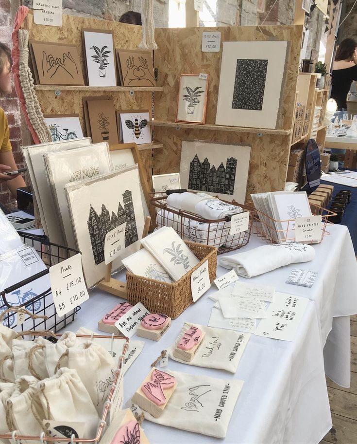 a table topped with lots of different types of greeting cards and paper bags on top of it