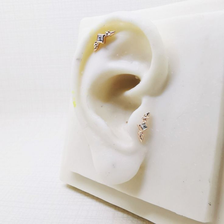 This a single  tiny Stud earring  Size - 16 gague bio flexible stem (push in to Bio Flexible stem without any twisting) 6,8 and 10mm length available How to wear : put bio stem from back side of your tragus/helix/cartilage/lip first and then press top part in to bio stem from the front Easy to wear, it's simple just silver heart pushed in to Bio Flexible post without any twisting. Materials: Sterling silver 92.5 Rose gold plated Gemstone: Cubic zirconia in White diamond color  2mm Square shape Dainty Cubic Zirconia Piercings For Everyday, Dainty Everyday Piercings With Cubic Zirconia, Minimalist Cubic Zirconia Piercings For Anniversary, Minimalist Cubic Zirconia Anniversary Piercings, Delicate Tiny Huggie Piercings, Dainty Diamond Internally Threaded Piercings, Dainty Cubic Zirconia Ear Cuff For Everyday, Tiny Minimalist Cubic Zirconia Earrings, Dainty Rose Gold Diamond Earrings