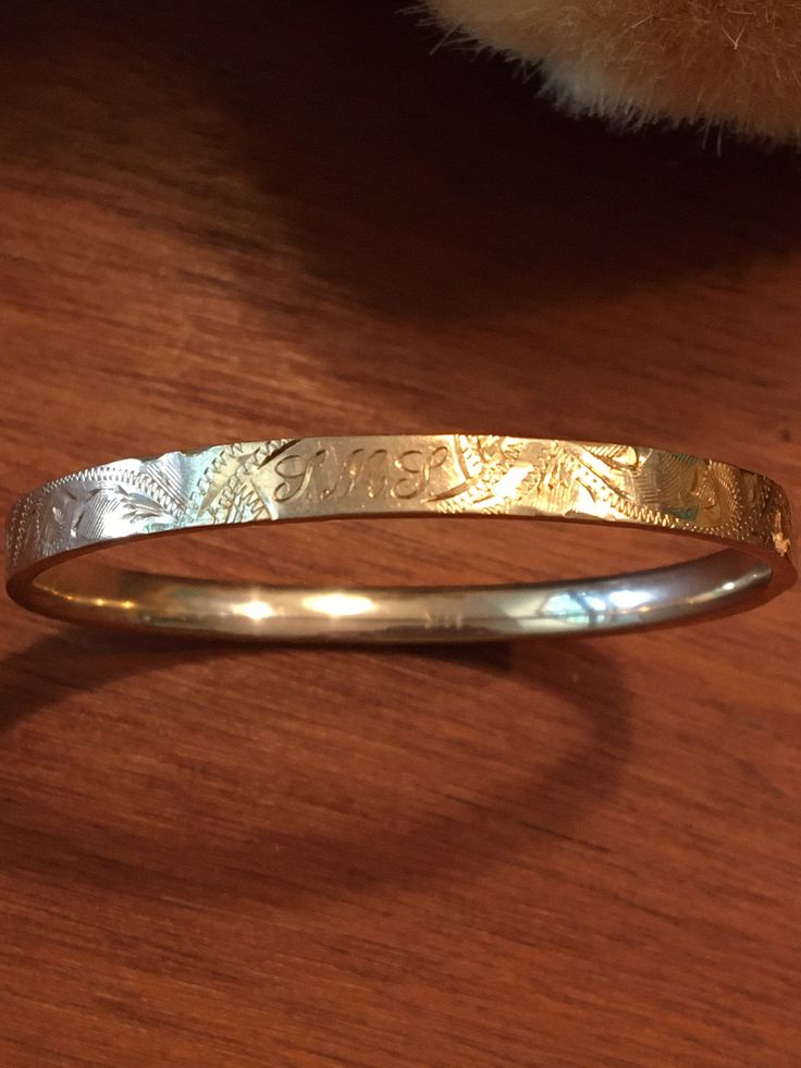 "This is a remarkable classic little girl baby bangle bracelet. Hand engraved, perfect clasp, excellent condition considering its age. One small \"love\" dent. Engraved initials LML which are very flowery and difficult to read. It measures approximately 3 1/16th\" wide , and oval is approximately 2\"x 1 3/4 \". Weighs approximately 4.6 gms. Marked 14kt in bracelet and clasp bar. Keepsake and an heirloom would make a delightful, unique baby gift or a gift to a little girl to keep forever! Inside Unique Baby Gift, Star Bangle, Baby Girl Toddler, Baby Bangles, Red Spinel, Engraved Initials, Baby Bracelet, Unique Baby Gifts, Girl Toddler