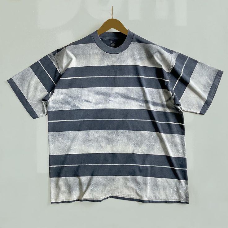 Striped t shirt, Double Sided bleached t shirt, faded black cotton shirt, Complete with short sleeves and a ribbed mock neck for a sophisticated look. SELLER NOTE: This shirt is made to order, Bleached t-shirt is Handmade products may be a slight difference in color / vibrancy from the screen to the finished product. T-SHIRT Faded black shirt 100% cotton, 20 singles, 6.7021-7.0548oz (190-200 g/m2)  - UNISEX sizes M - 2XL, Please see Measurement Guide in photos.  - Ribbed mock neck - Single stitc Gray Distressed Short Sleeve T-shirt, Washed Black Short Sleeve Grunge T-shirt, Faded T-shirt For Summer Streetwear, Oversized Bleached T-shirt For Summer, Bleached Black T-shirt For Streetwear, Gray Short Sleeve Distressed T-shirt, Faded Soft-washed T-shirt For Streetwear, Tie-dye Short Sleeve T-shirt For Streetwear, Washed Short Sleeve Grunge T-shirt