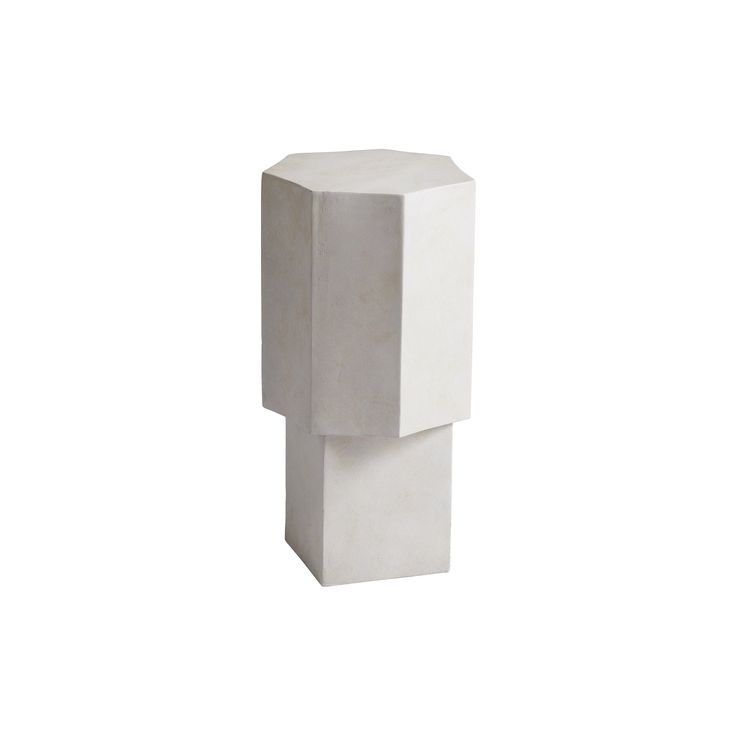 a white sculpture sitting on top of a table