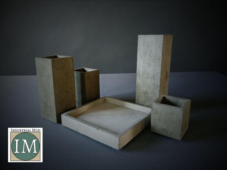 three cement blocks are stacked on top of each other, with one empty box in the middle