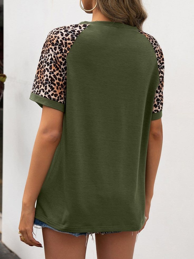 The EMES SHOP tee is detailed with a fierce two tone design with leopard prints. Features a round neck line. short sleeves. and regular fit. Pair it with denim shorts and sneakers for an easy look.MATERIAL:100%Soft Poly MEASUREMENTS:Product Length 25"-27"in Small | Bust & Hem Width : 35"-37"in Medium| Bust & Hem Width : 37"-39"in Large| Bust & Hem Width : 39"-41"in X Large| Bust & Hem Width : 41"-43"in MEASUREMENTS:Product Length 65-69 cm Small | Bust & Hem Width : 88"-93"cm Medium| Bust & Hem Width : 93"-98"cm Large| Bust & Hem Width : 98"-103"cm X Large| Bust & Hem Width : 103"-108"cm Casual Leopard Print Crew Neck T-shirt, Trendy Cotton T-shirt In Leopard Print, Casual Summer T-shirt With Raglan Sleeves, Trendy Leopard Print Cotton Tops, Casual Leopard Print Spring Tops, Leopard Print Relaxed Fit Short Sleeve Tops, Leopard Print Short Sleeve Top With Relaxed Fit, Leopard Print Tops With Relaxed Fit And Short Sleeve, Relaxed Fit Leopard Print Tops With Short Sleeves