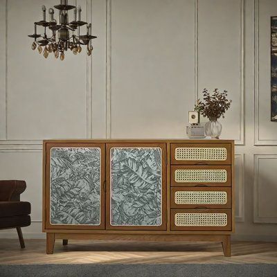 a living room scene with focus on the sideboard and chandelier in the background