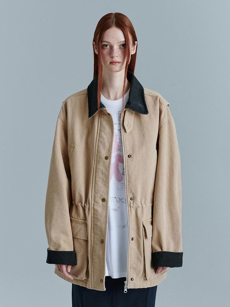 This is MARGESHERWOOD’s work jacket features a loose-fitting oversized silhouette made from Oxford fabric. Denim accents on the collar and cuff add detail to the design. The collar can be worn up using the collar button detail. After production, a post-process stone washing adds a natural vintage mood to the stitching and seam areas. The internal waist string allows for various silhouette adjustments. It can be worn open with a front zipper closure and pocket snap buttons. The sleeve seam details allow for voluminous sleeves. With its generous size, it can be worn by both men and women.- Ideal for daily wear- Can be paired with different styles to create various looks- The brand logo is embroidered on the square outer pocket, adding a focal point to the look Khaki Utility Jacket With Corduroy Collar For Work, Oversized Neutral Cotton Outerwear, Spring Utility Jacket With Corduroy Collar For Work, Oversized Spring Outerwear With Corduroy Collar, Spring Oversized Outerwear With Corduroy Collar, Beige Outerwear With Flap Pockets For Streetwear, Classic Beige Outerwear With Corduroy Collar, Beige Corduroy Collar Outerwear For Spring, Beige Outerwear With Corduroy Collar For Spring