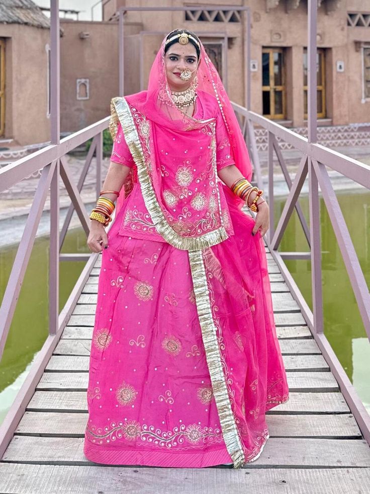 Upada Silk and Hamrahi Pure Party Wear festive kasab zari Work Rajputi Poshak In Pink Colour Product Details: Fabric: High-quality important (Upada Silk) Sout Work: Exquisite Kasab Zari Kundan Resham Full odni men border odni me Four Side border Odna me Beutiful Hand work Odhna Fabric: Hamrahi pure  Gota Kiran Complete: Enhancing the beauty of the outfit Color: Pink Colour Occasion:Mehendi Sangeet, wedding Party Wear Washing Instruction:Dry Wash Color : Same as pr photo ( 5 to 7 % color version Traditional Wear With Meenakari For Navratri, Traditional Meenakari Choli For Festive Occasions, Festive Saree With Tilla Work, Festive Saree With Tilla Details For Festivals, Festive Saree With Tilla For Festivals, Semi-stitched Traditional Wear For Diwali Celebration, Pink Shantoon Traditional Wear With Dupatta, Traditional Wear For Diwali Celebration With Traditional Drape, Traditional Celebration Sets With Dupatta