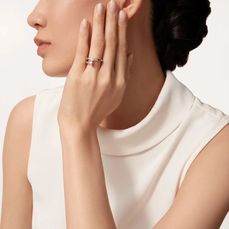 Elevate your style with the JUSTE RING 2.65MM in sleek silver. This elegant piece adds a touch of sophistication to any outfit, making it the perfect accessory for any occasion. Its understated yet refined design is sure to make a statement and impress all who see it. Embrace luxury and elevate your look with the JUSTE RING. ADDITIONAL INFORMATION Color: Silver Stone : No REF.: B4216900 Material:- 925 Sterling Silver - 18k Gold Plated- 18k Real Gold ( contact us via instagram) Width: 2.65 mm Rin Elegant Open Ring Stackable Rings As Gift, Elegant Stackable Open Rings As Gift, Elegant Stackable Open Rings For Gifts, Elegant Couple Rings With Diamond Accents For Gift, Cartier Rose Gold Wedding Ring, Elegant Pearl Ring With Diamond Accents For Formal Occasions, Elegant Rose Gold Stackable Rings For Gift, Elegant Diamond Pearl Promise Ring, Elegant Diamond Pearl Ring For Promise