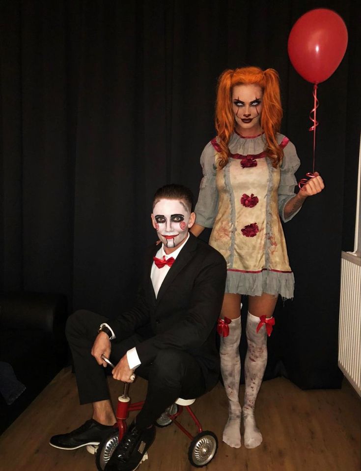 two people dressed up as clowns pose for a photo