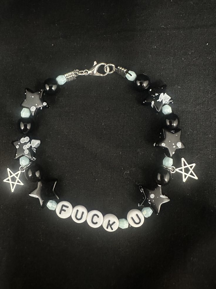 My first ever jewellery item - listing in this Etsy store just so I can see if there's any interest and if there is I'll create a new seperate store my jewellery I make!!  "F*ck u" black n blue stars beaded bracelet with adjustable clasp Size: made to fit small-medium adults wrist with slight adjustment (can make bigger upon request)  I'll have much more designs if this one sells too xx  Materials:  - durable black stretch elastic string  - high quality plastic beads  - metal charms n fixings Black Aesthetic Bracelets, Metal Charm Bracelet, Alt Beaded Bracelets, Grunge Bracelet Ideas, Emo Bracelet Ideas, Goth Bracelets, Fck U, Can Jewelry, Letter Bead Bracelet