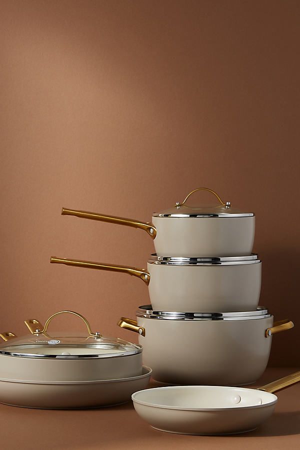 a stack of pots and pans sitting next to each other on top of a table