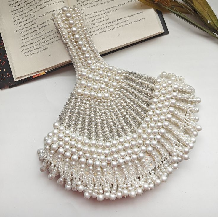 Luxury Statement Pearl Beaded Handbag Wedding Wristlet Elegant Party Wristlet Pouch, Elegant Party Pouch Wristlet, Handheld Beaded Evening Bag For Wedding, Elegant White Clutch Wristlet, Elegant White Pouch Wristlet, Silver Wedding Clutch With Pearl Handle, Wedding Handheld Clutch With Pearl Embroidery, Traditional White Evening Bag With Pearl Handle, White Pearl Wedding Clutch