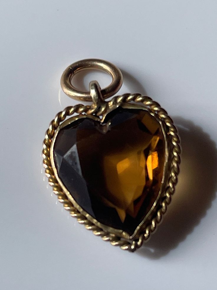 Antique citrine charm heart pendant, 2cms. Tested for 9ct. Vintage Charm Heart-shaped Yellow Gold Jewelry, Vintage Charm Yellow Gold Heart Pendant Jewelry, Yellow Gold Heart Pendant With Vintage Charm, Yellow Gold Heart Jewelry With Vintage Charm, Victorian Heart-shaped Charms Jewelry, Victorian Heart Charms Jewelry, Collectible Yellow Gold Necklace With Heart Charm, Antique Yellow Gold Jewelry With Heart Charm, Victorian Vintage Charm In Yellow Gold