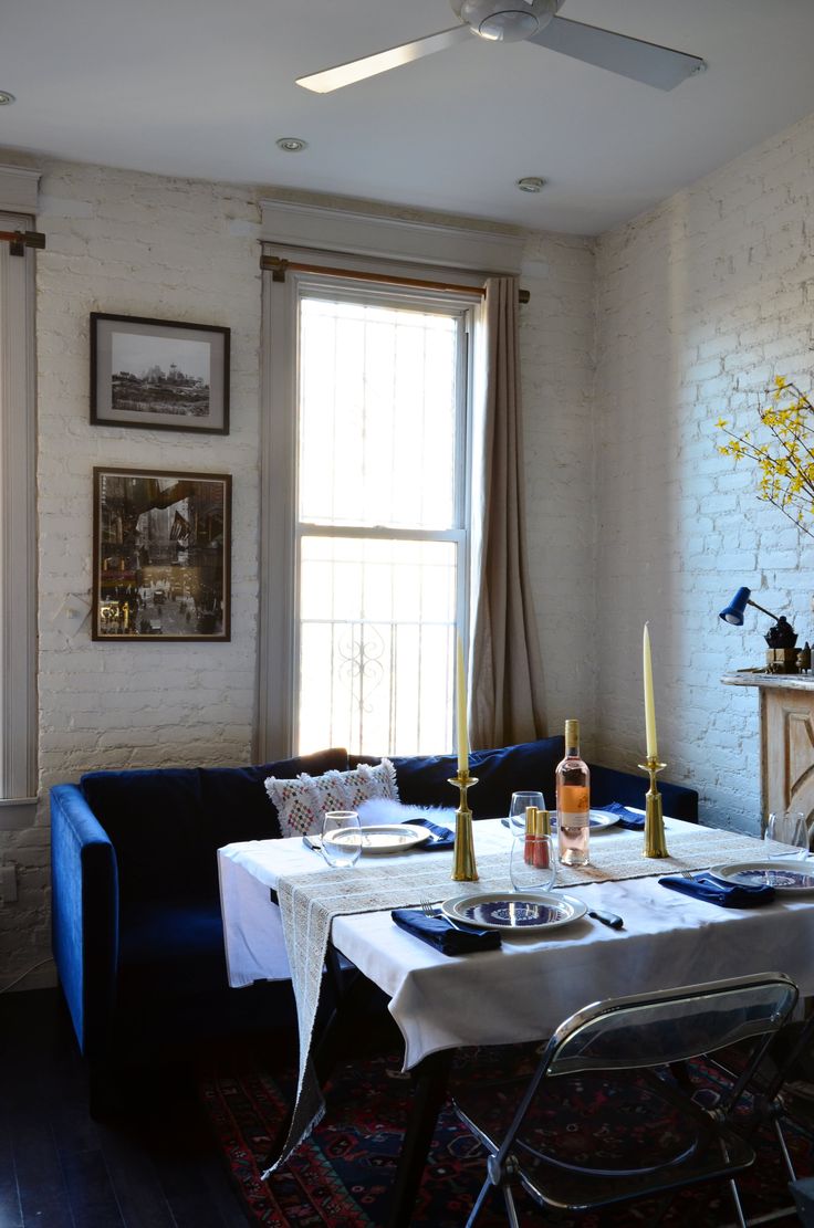 a dining room table with place settings on it