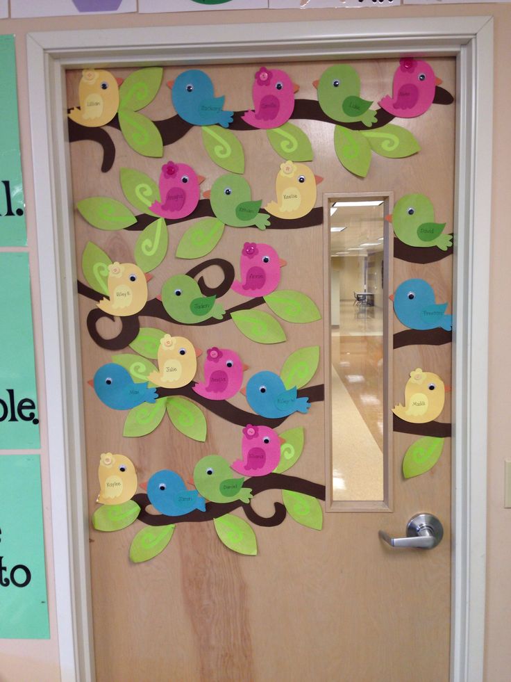 a door decorated with colorful birds on a tree branch