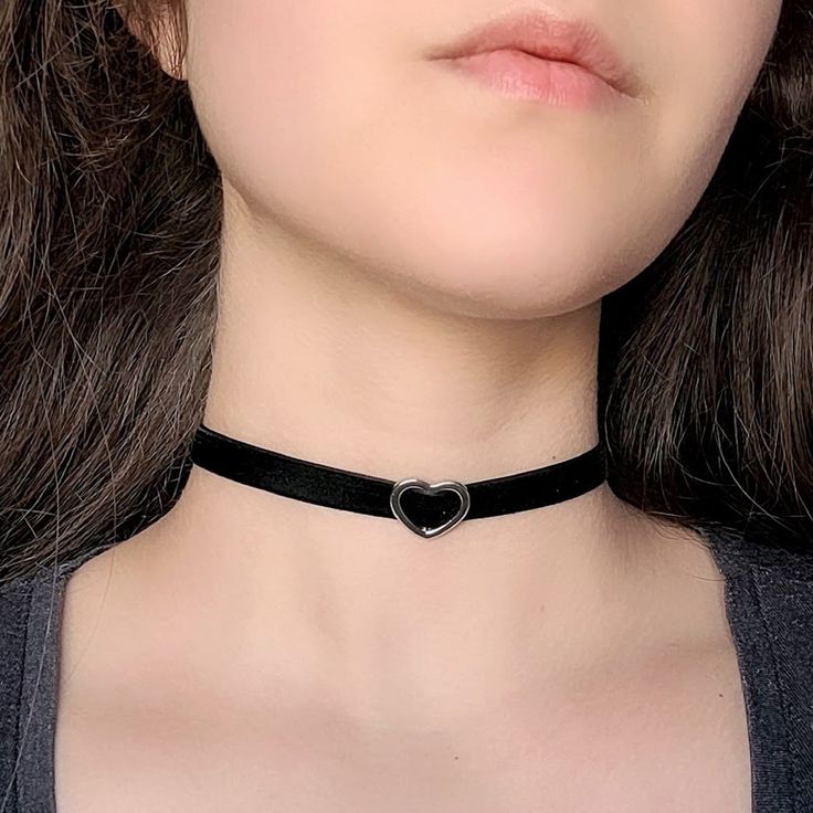 "A classic goth inspired choker featuring black velvet ribbon and your choice of silver, gold and bronze heart slider charm. The length shown in photos is 12\" and more options are available. Each size comes with an additional 2.5\" extender chain. For best fit, measure around the smallest part of your neck (close to center) and choose the next smallest size. If you would like a custom length, send me a message and I can make that for you :) Gold and silver tone options are gold or silver plated Emo Choker Jewelry For Concerts, Emo Choker Jewelry For Concert, Adjustable Heart Charm Choker For Party, Emo Style Necklaces As Gifts, Black Heart Pendant Choker With Charm, Black Heart Pendant Choker With Heart Charm, Adjustable Choker For Valentine's Day, Punk Heart-shaped Choker As A Gift, Adjustable Gothic Heart-shaped Jewelry