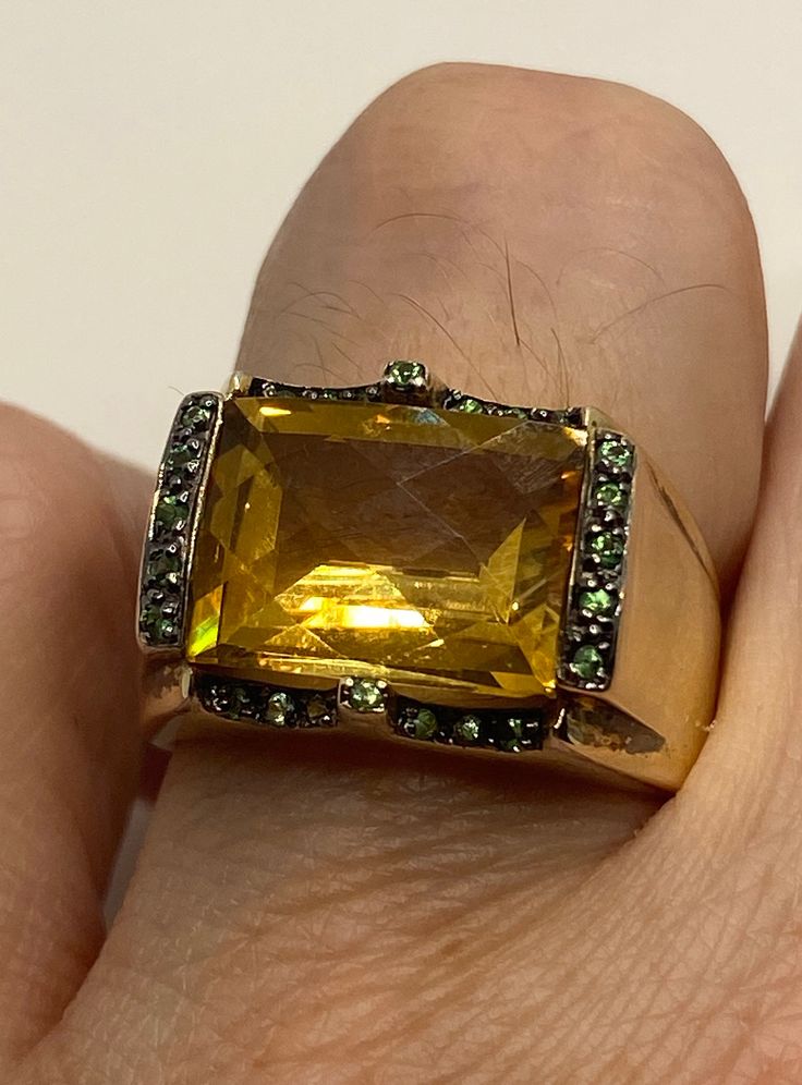 Vintage golden citrine and green chrome diopside 925 sterling silver cocktail ring Unusual cut of citrine in 925 sterling silver setting Handmade Size 7 Can be resized, my jeweler charges $10-$20 All rings are shipped in a nice gift box. Check out our over a THOUSAND great reviews Engraving is $4 per letter and is not always perfect depending on the piece. It can take a few days if the jeweler is busy. This is payable to Paypal Judithsltd@gmail.com Yellow Multi-stone Rings For Formal Occasions, Formal Yellow Multi-stone Rings, Formal Green Multi-stone Sapphire Ring, Formal Yellow Multi-stone Jewelry, Gold Multi-stone Citrine Gemstones, Formal Gold Sapphire Ring With Gemstone Accents, Formal Emerald Cut Multi-stone Topaz Ring, Formal Green Citrine Jewelry, Yellow Rings With Gemstone Accents For Formal Occasions