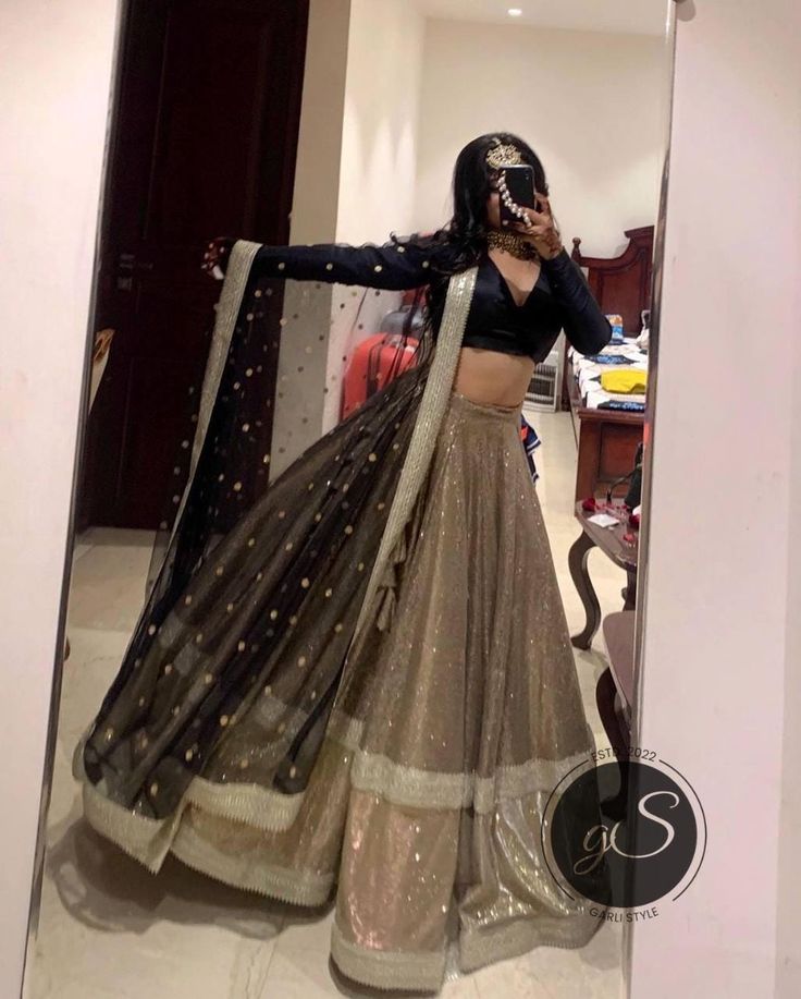 Designer Black and Golden Lehenga Choli for women ready to wear in USA Indian Pakistani Designer bridal Wedding Handmade Outfit Dress This is a made to order Lehenga Choli Dupatta Blouse Fabric : Heavy Silk Lehenga Fabric : Net with  laces Dupatta Fabric: Net with laces Color - As same as in picture , also please check our color chart all colors can be possible. Size: This is custom made as per your size. Any size possible be it for kids or plus sizes women. post your order I will send you a measurements reference sheet using which you can provide details required to make your outfit. Handling time: Don't worry, just tell me, I will process it accordingly and deliver on or before a delivery date you mention. Our Offerings: At Garli style , we provide outfits for every occasion, including: Semi-stitched Bollywood Lace Salwar Kameez, Traditional Organza Dress With Pallu, Festive Art Silk Dress With Sheer Dupatta, Party Wear Gown With Sheer Dupatta And Traditional Drape, Party Wear Dresses With Sheer Dupatta For Festive Occasions, Festive Party Wear Gown With Dupatta, Party Gown With Resham Embroidery In Saree Style, Navratri Raw Silk Dress With Sheer Dupatta, Bollywood Style Dress With Traditional Drape In Net