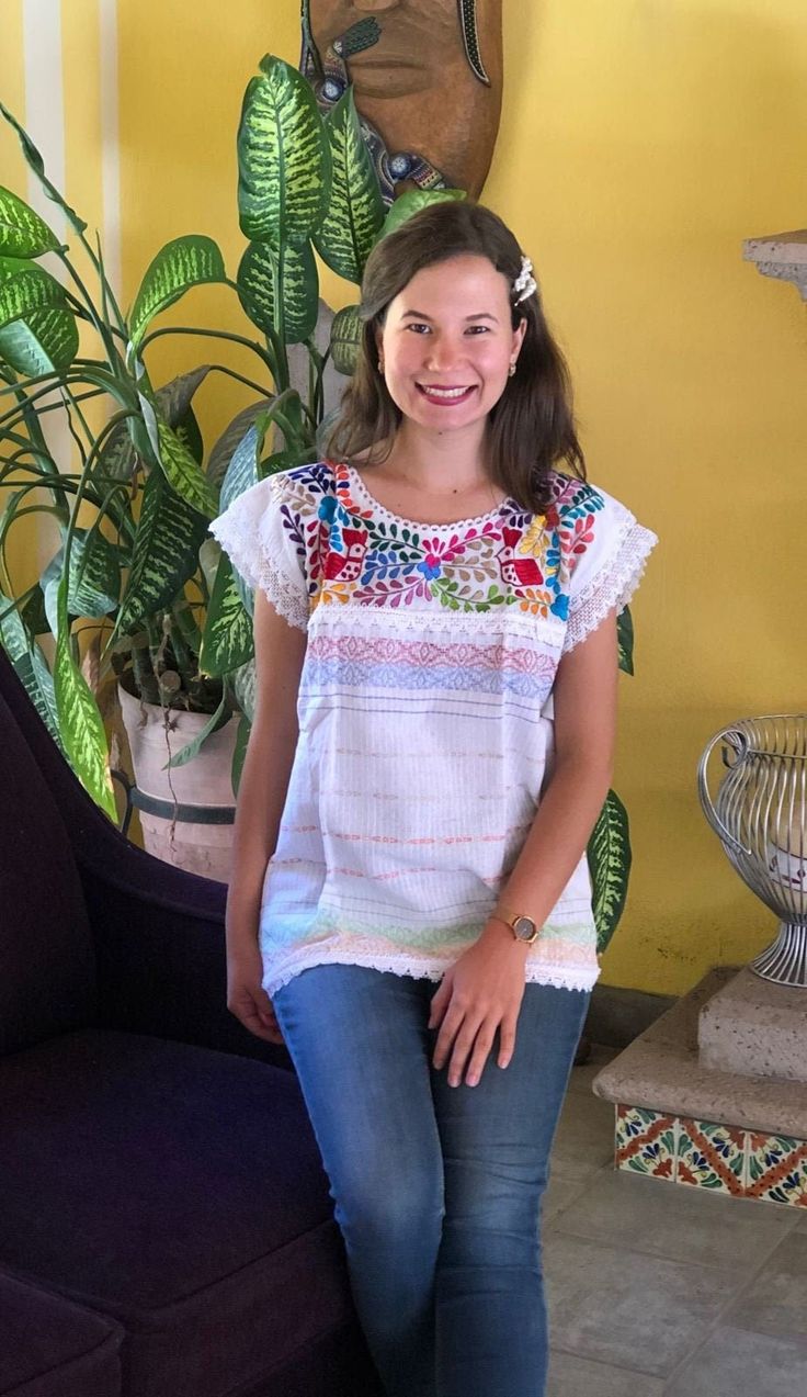 Beautiful traditional Mexican blouse made on a pedal loom with floral motifs, hand-embroidered in bright thread. Blouses have unique embroidery so may vary. Mexican textile art has centuries of history and creativity throughout the country. Mexico is recognized as one of the leading countries with a beautiful artistic production in the textile world, miraculous hands of talented artisans from different states of the country create stunning embroidery clothing, and various items. #Oaxaca #Chiapas Bohemian Peasant Top With Multicolor Embroidered Neckline, Bohemian Top With Multicolor Embroidery, Casual Short Sleeve Blouse With Intricate Embroidery, Traditional Multicolor Embroidered Top With Embroidered Sleeves, Folk Peasant Top With Multicolor Embroidered Neckline, Bohemian Blouse With Intricate Multicolor Embroidery, Traditional Cotton Top With Embroidered Sleeves, Summer Blouse With Intricate Embroidery, Cotton Blouse With Multicolor Embroidered Sleeves