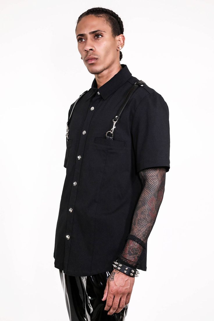 Lip Service Short Sleeve Gangsta Pranksta Shirt. Gangsta Pranksta is back with this all black short sleeve version of the classic Vito the Fixer Randazzo fancy shirt. Lobster clip straps from pockets to center back D-ring. Made in China (because that's where the fabric comes from) Hand Wash Cold, Line Dry 80% poly 20% spandex bengaline with PU details Front Snap Closure Stretch Fit LS-174 Black Short Sleeve Tops For Alternative Fashion, Black Fitted Gothic Shirt, Fitted Short Sleeve Alternative Tops, Punk Short Sleeve Shirt For Streetwear, Punk Style Short Sleeve Streetwear Shirt, Fitted Alternative Style Top With Short Sleeves, Fitted Black Punk Shirt, Black Fitted Punk Shirt, Alternative Short Sleeve Summer Shirt