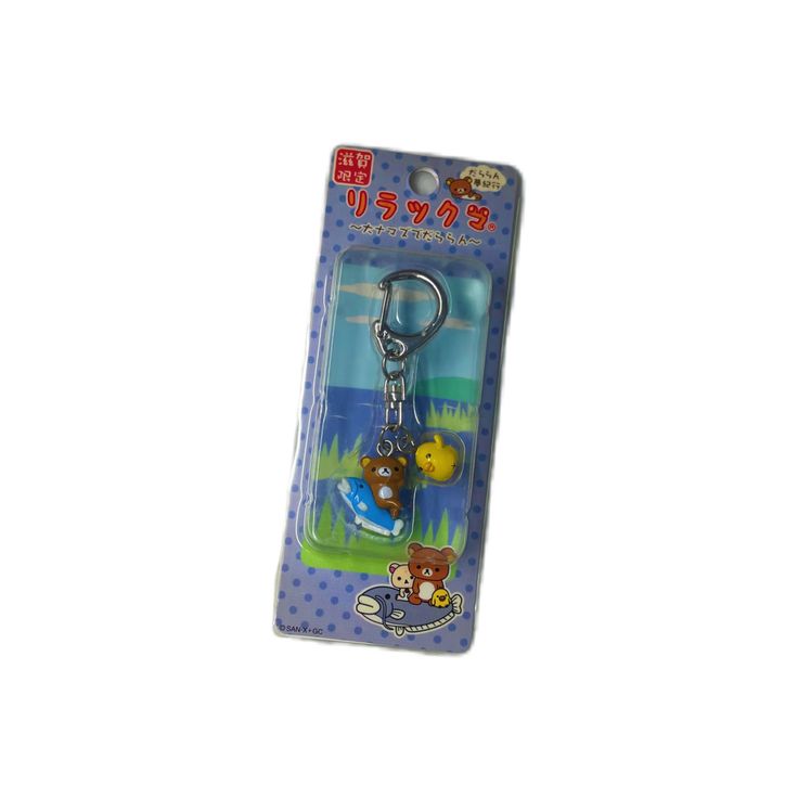 a keychain with a cartoon character on it's front and back side