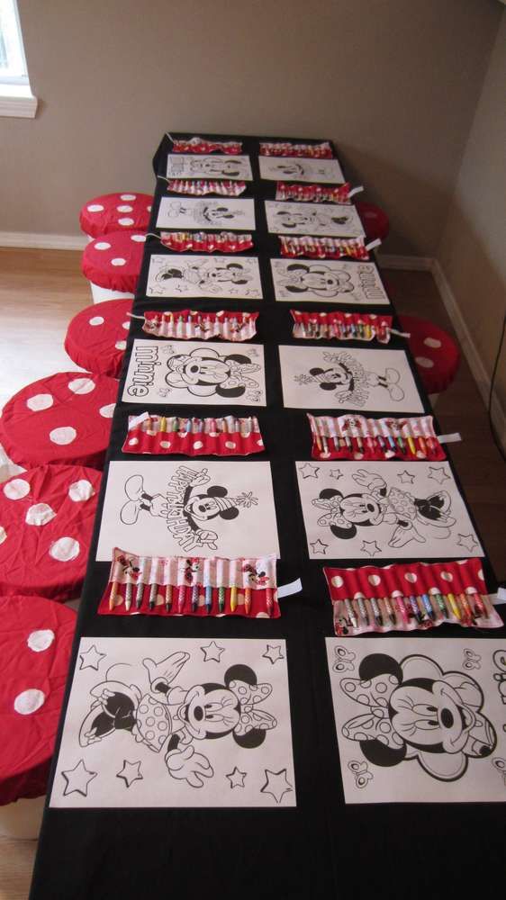 a long table covered in mickey mouse drawings