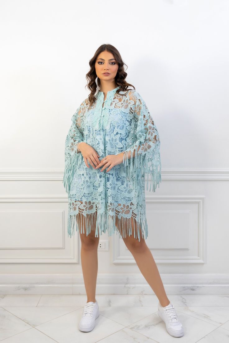 (SALE ITEM - FINAL SALE)Featuring: Floral Lace Fringe sleeves Unlined Bell sleeves Band collar Color: Tiffany blue.Brand: Unmatched BYU.Match it with a slip dress - The model is wearing a baby blue mini slip dress (Shop slip dresses)Size: Free Size. "fits sizes between 2 (US) up to 24 (US)"Exact Caftan Measurements: Bust: 52 (Inches)Hem: 63 (Inches)Length: 32.5 (Inches)This caftan is available in multiple colors Spring Beach Cover-up Dress With Tassels, Elegant Spring Kaftan For Beach Cover-up, Long Sleeve Spring Kaftan With Tassels, Long Sleeve Kaftan With Tassels For Spring, Spring Kaftan With Tassels And Kimono Sleeves, Sheer Light Blue Dress, Spring Fitted Kaftan With Kimono Sleeves, Elegant Beach Cover-up Dresses With Kimono Sleeves, Long Sleeve Fringe Cover-up For Spring