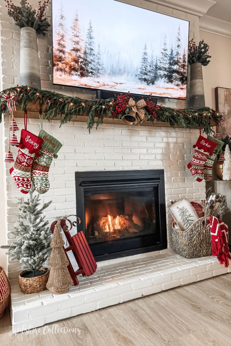 a fireplace decorated for christmas with stockings and presents