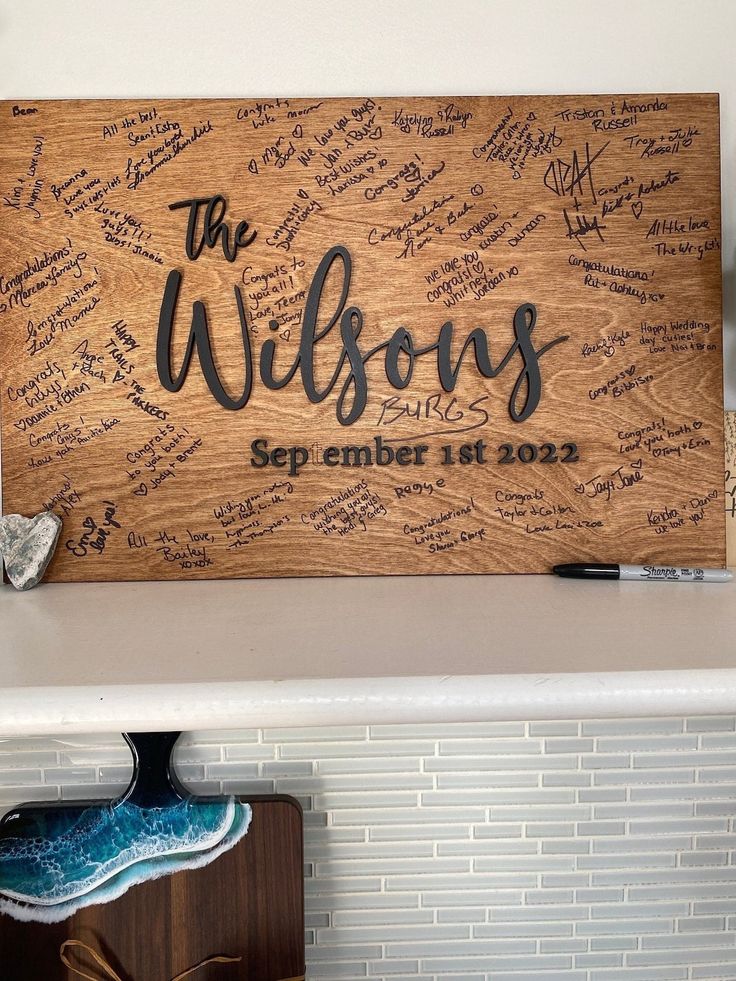 a wooden sign with writing on it that says the willows and is surrounded by shoes