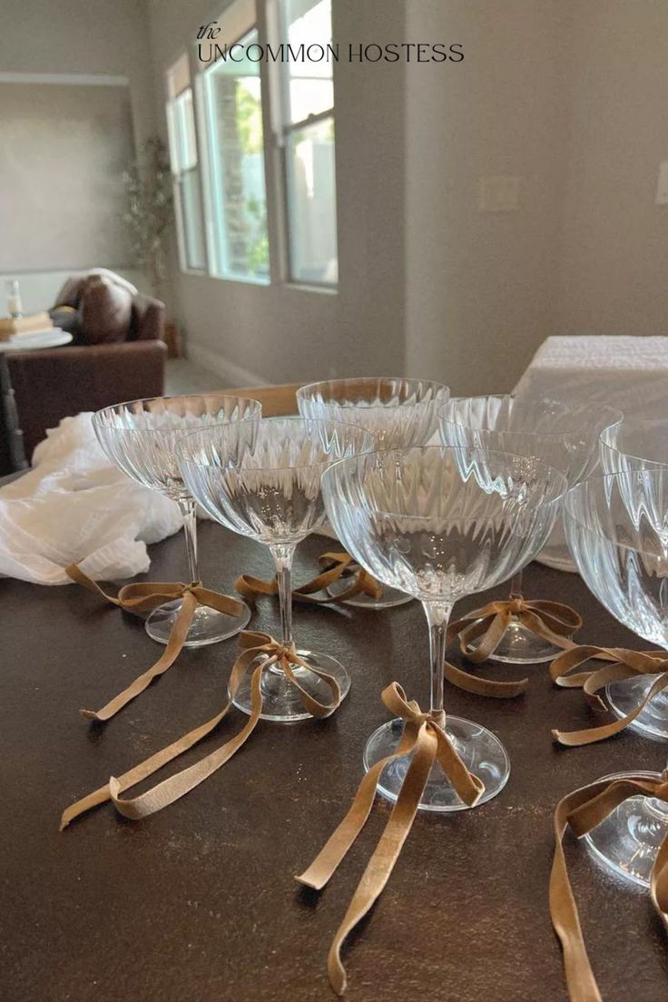 From an engagement party or bachelorette party to girls night with friends or birthday celebrations - tying bows around your champagne glasses is a classy, elegant, and timeless way to elevate any event or get together. These champagne coups are one of my favorite essentials to have as a hostess. Buy a set now using my affiliate link and get a ribbon color to match the vibe of your event! Engagement Party Dinner, Christmas Engagement Party, Engagement Party Table, Tying Bows, Engagement Party Diy, Engagement Party Themes, Hens Party Themes, Classy Bachelorette Party, Elegant Engagement Party