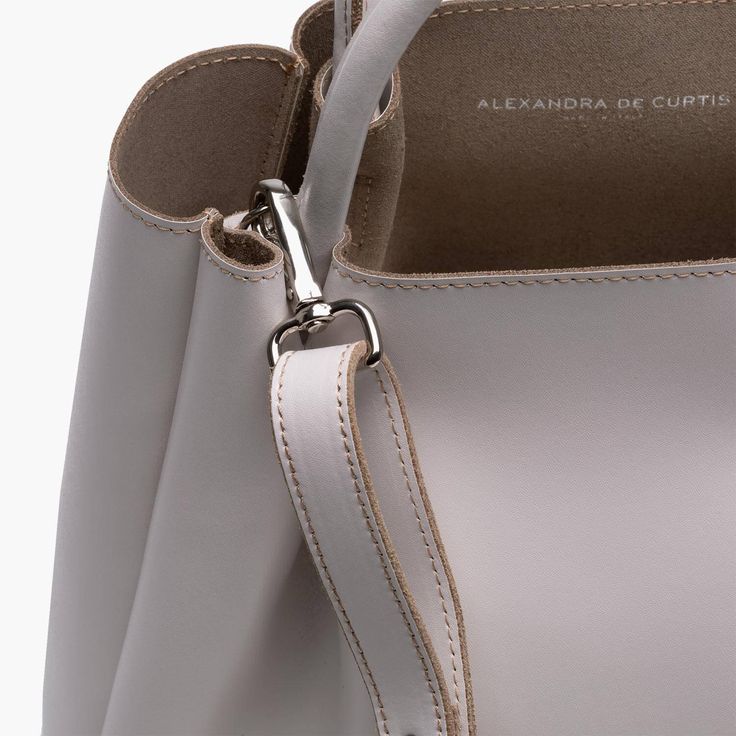 The Amalfi Large Leather Tote Bag exudes an effortless sophistication and timeless elegance. Its generous size and pleated design make it the ideal companion for any outfit, from the most formal of work settings, to a relaxed day at the beach. Crafted with luxurious Italian leather, this piece promises an effortless style that will turn heads everywhere you go. Timeless Structured Bag With Smooth Grain, Elegant Rectangular Bucket Bag For Business, Classic Bucket Bag With Detachable Handle For Business, Classic Business Bucket Bag With Detachable Strap, Classic Business Bucket Bag With Detachable Handle, Elegant Daily Use Bucket Bag, Timeless Structured Everyday Bag, Elegant Top Handle Shoulder Bag For Everyday, Timeless Everyday Bags With Rolled Handles