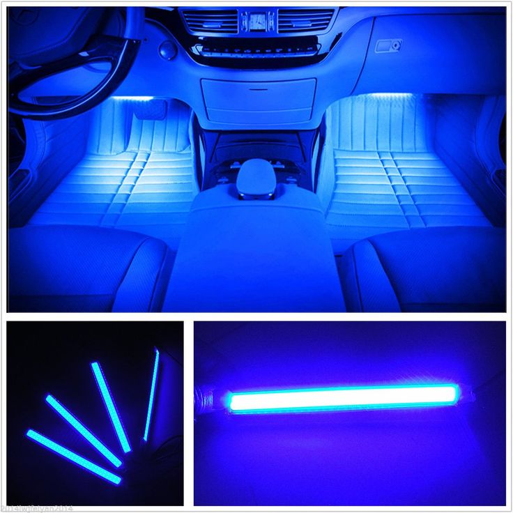 the interior of a car with blue lights