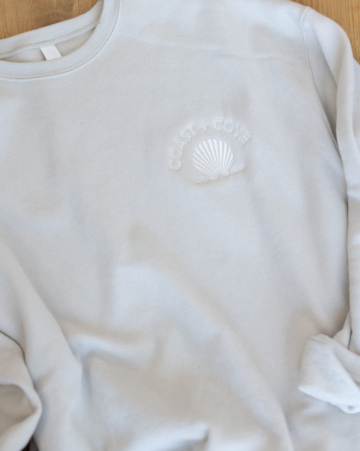 Elevate your style with our latest merch. The Sweatshirt comes in a cream color with a tone-on-tone embroidered Coast + Cove logo. It is lightweight, buttery-soft, and perfectly cozy. Cream Sweatshirt With Embroidered Logo Relaxed Fit, Casual Cream Sweatshirt With Embroidered Logo, Cream Crew Sweatshirt For Spring, Casual Cream Sweatshirt With Embroidered Text, Comfortable Cream Cotton Sweatshirt, Casual Embroidered Cream Sweatshirt, Casual Cream Embroidered Sweatshirt, Casual Cream Tops With Embroidered Logo, Cream Casual Tops With Embroidered Logo