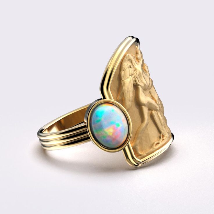 Indulge in luxury with the Love And Psyche Gold Ring. Crafted in ancient style from 14k or 18k solid gold, this Italian-made ring features two natural welo opals that add a touch of elegance and sophistication. Perfect for those with refined taste. 18mm wide on the top, 4,2 mm wide on the bottom side 14k or 18k Gold 0.5 Ct Welo Opal - Dimensions (mm) 7 x 5 x 2,5mm 0.5 Ct Smoked Welo Opal - Dimensions (mm) 7 x 5 x 2,5mm Italian Ring, Neutral Jewelry, Love And, Jeweled Earrings, Italian Jewelry, Ring Pendant Necklace, Welo Opal, Engagement Ring Wedding Band, Pendant Bracelet