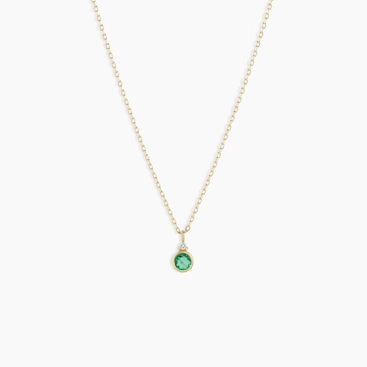 A modern heirloom. Introducing our take on a traditional style. Whether you wear yours or a loved one’s, a birthstone necklace is an easy way to add color and meaning to your look. This birthstone necklace features a 14k gold chain and diamond detail and makes for a perfect, personal gift. Emerald is May's birthstone. Product Details Diamond: 0.01 total carat weight, 1.3 mm GH SI1-SI3 Emerald: 0.15 total carat weight, 3 mm genuine emerald 14k solid gold 16" chain + 2" extender. Adjustable in 1" 14k Gold Filled Jewelry With Gemstone Accents, Recycled Gold Gemstone Jewelry For May Birthstone, Minimalist Emerald Necklace In Yellow Gold, Delicate Gemstone Round Pendant Jewelry, Delicate Round Pendant Gemstone Jewelry, Elegant Birthstone Necklace With Recycled Gold, Everyday Gold Jewelry With Gemstone Accents, Gold Jewelry With Gemstone Accents For Everyday, Delicate May Birthstone Round Pendant