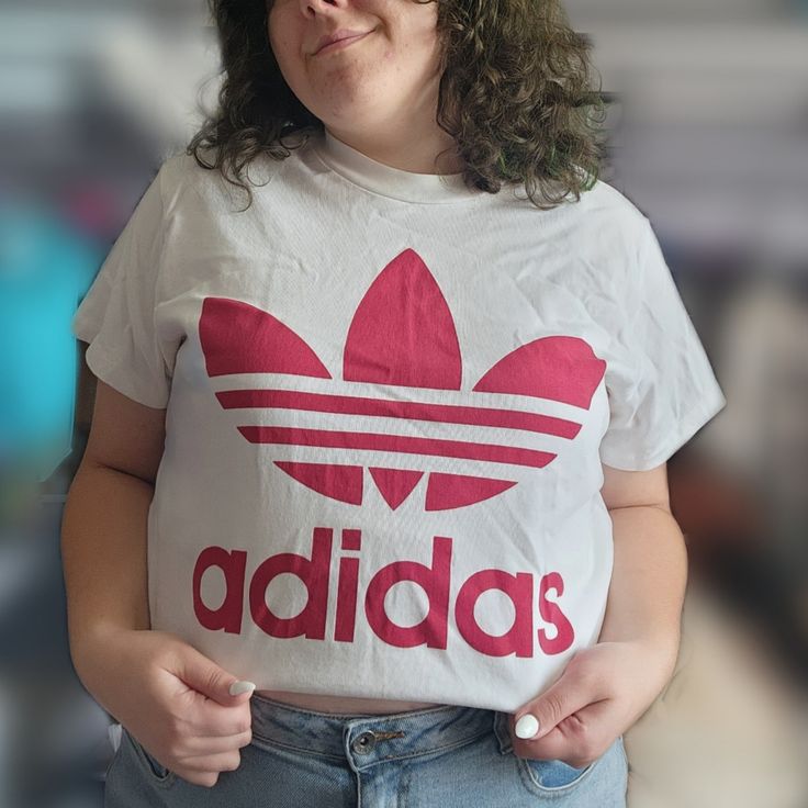 This Adidas Tee Is Perfect For A More Sporty Look, Or Something A Little Streetwear. Worn Maybe Once, It's In Practically Brand New Condition. Would Be Great For Anyone, And Looks Super Cute Styled Multiple Ways. Not Cropped, Just Styled That Way For Photos. Trendy Adidas T-shirt With Letter Print, Adidas Logo Tops, Adidas Logo Spring Crew Neck Top, Adidas Logo Crew Neck Top For Spring, Basic Adidas Logo Crew Neck Tops, Basic Adidas Crew Neck Tops, White Adidas Logo Crew Neck T-shirt, White Adidas Graphic Tee, White Adidas Logo Casual Tops