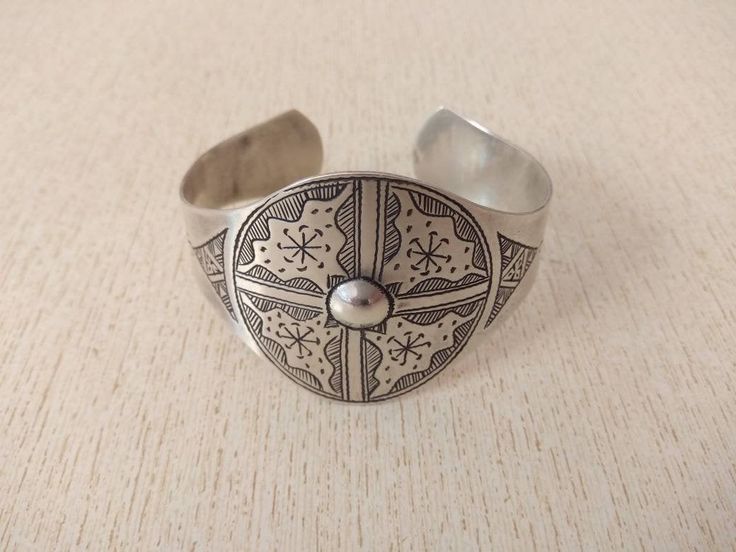 Moroccan silver bracelet with 2 hallmarks,, beautifully engraved. Good patina, Beautiful and easy to wear. 100% handmade item. This bracelet is open and can open or close to fit your wrist. Top widest side : 4,5 cm (1,8 inches) Inner Diameter : 6,5 cm (2,5 inches) Weight : 31,9 g Sterling Silver Stamped Bangle Bracelet For Gift, Stamped Sterling Silver Bangle Bracelet For Gift, Stamped Sterling Silver Bangle Bracelet Gift, Symbolic Stamped Cuff Bracelet, Silver Etched Bracelets As A Gift, Silver Etched Bracelet As Gift, Unique Sterling Silver Bangle As Gift, Etched Sterling Silver Bangle Bracelet For Gift, Etched Sterling Silver Bracelet As Gift