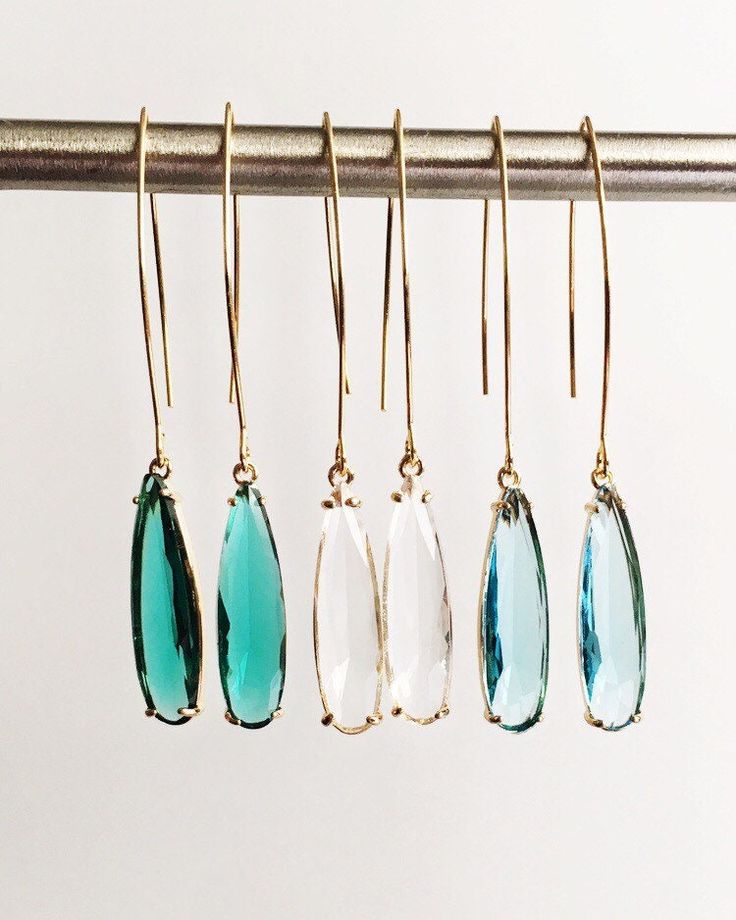 Clear, Emerald Green, and Aquamarine Teardrop and Gold Long Dangle Earrings ⟡ all items are designed and handcrafted in our studio ⟡ Long teardrop glass and gold long teardrop earrings. The glass stone is set into a gold plated over brass setting. These beautiful stones - clear diamond, emerald green, and aquamarine blue - are such beautiful stones and would be perfect to wear all year long. The long earring wire adds a dramatic but simple look that can easily be dressed up or dressed down.  This listing is for one pair of earrings.  OVERVIEW -3" in length -glass crystals -gold plated over brass (nickel free) MORE EARRINGS https://www.etsy.com/shop/Lynnique?ref=condensed_trust_header_title_reviews§ion_id=5813899 CONTINUE SHOPPING https://www.etsy.com/shop/lynnique REVIEWS "Another gorgeous Teardrop Linear Earrings For Party, Party Teardrop Linear Earrings, Single Dangle Teardrop Earring As Gift, Modern Crystal Drop Earrings Gift, Modern Crystal Drop Earrings For Gifts, Modern Drop Crystal Earrings For Gift, Party Drop Jewelry With Ear Wire, Single Long Drop Earring As Gift, Modern Dangle Crystal Earrings As Gift