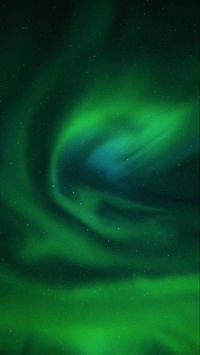 an aurora bore in the night sky with green and blue swirls on it's side