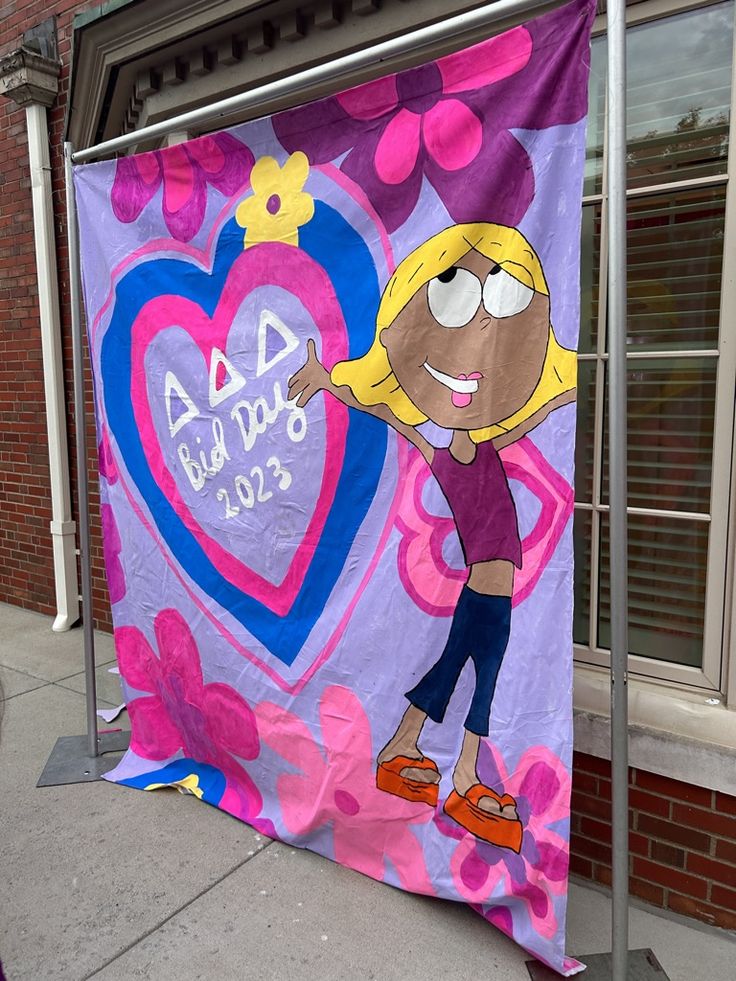 a large purple banner with a cartoon girl on it