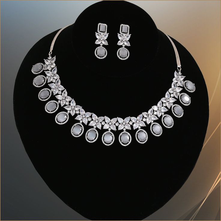 Unique and gorgeous wedding bridal fashion American diamond CZ White stone studded rhodium plated crystal jewelry. Indian Bollywood style AD choker necklace, earrings makes the perfect gifts for bridesmaids,Wife, Mother, Sister or Gift for Loved ones. Total length of the necklace + length of the extender is 17 inches. Length of Earring is 1.5 inches. Best suitable for Party Wear / Fashion Wear for Any Occasion. Care Instructions: We recommend avoiding direct exposure to fragrances. Silver Plated Jewelry Sets For Wedding, Silver Diamond Jewelry Sets With Jewels, Silver Jewelry Sets With Plating For Formal Occasions, Silver Plated Jewelry Sets For Formal Occasions, Formal Silver Plated Jewelry Sets, Silver Crystal Jewelry Sets With Elegant Design, Dazzling Silver Jewelry Set With Sparkling Stones, Silver Jewelry Sets With Cubic Zirconia Jewels, Diamond White Bridal Necklace With Cubic Zirconia