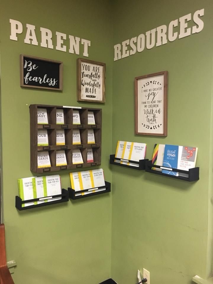 there are several books on the shelves in this room that is decorated with different types of papers