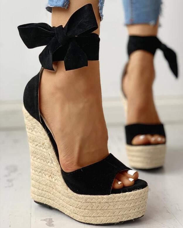 Black Bow Sandals For Summer, Trendy Suede Wedge Sandals For Summer, Summer Strappy Suede Heels, Summer Party Fabric Heels, Chic Fabric Wedge Sandals For Vacation, Black Fabric Sandals For Summer, Spring Suede Wedge Sandals For Parties, Summer Party Suede Lace-up Sandals, Spring Party Suede Wedge Sandals