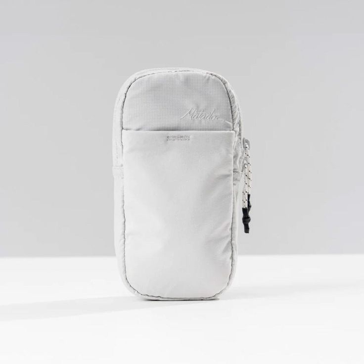 a white bag with a zipper on the side