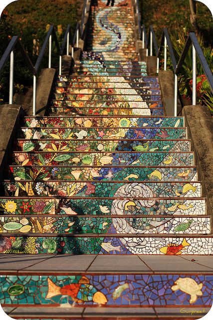 the stairs are painted with colorful designs on them